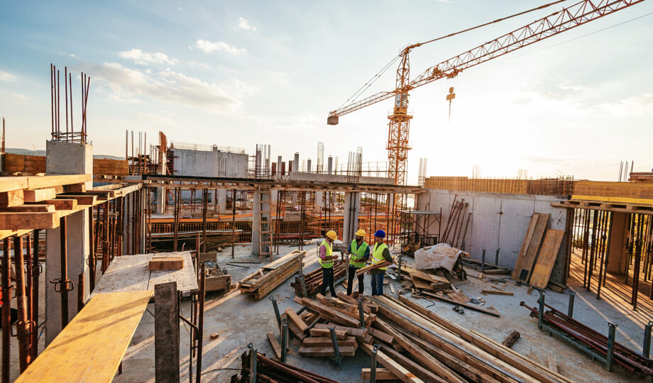Investors and contractors on construction site construction materials solutions